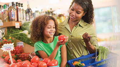 mom and daughter in the grocery store 